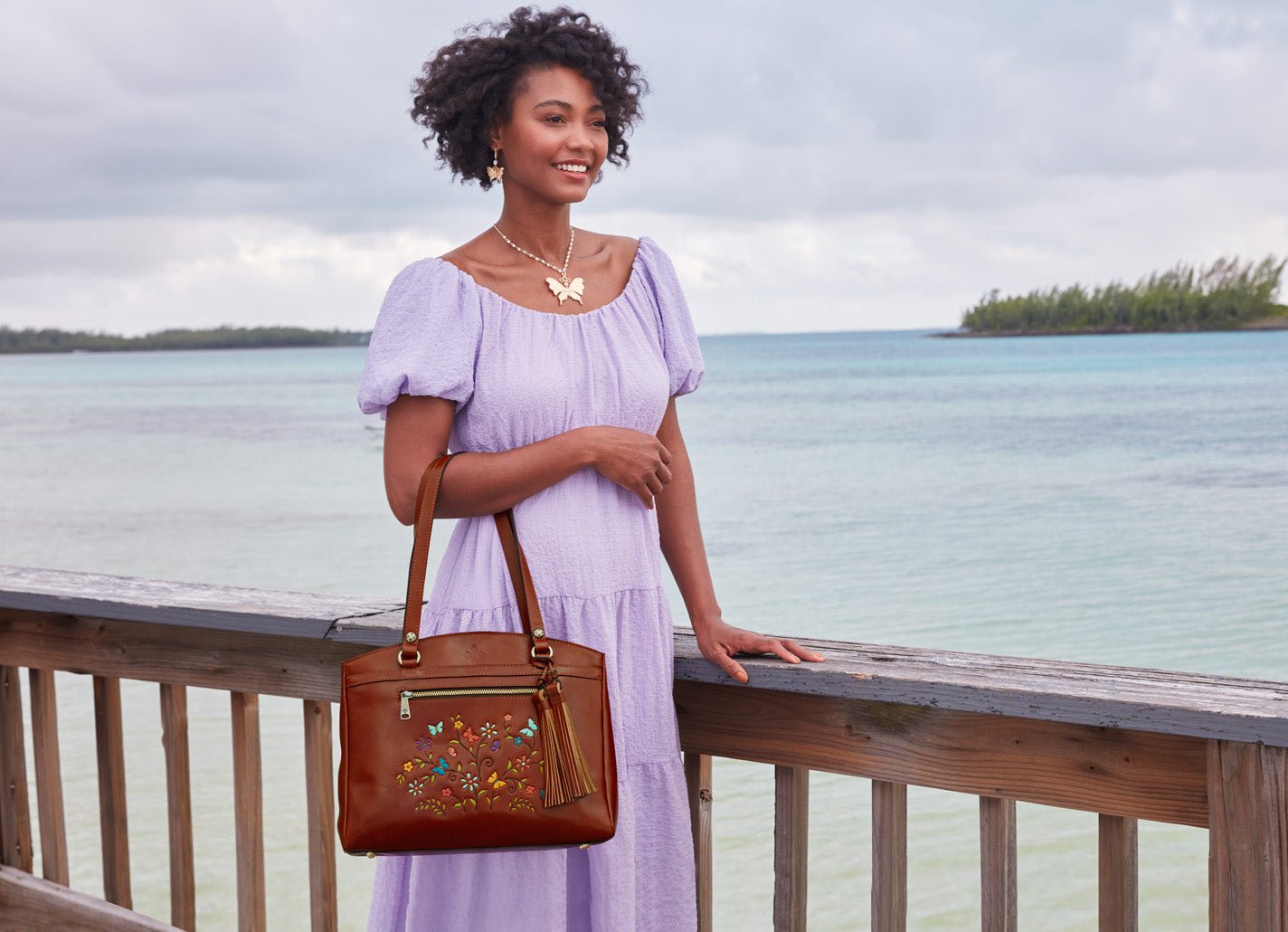 hand painted tooled leather tote on model