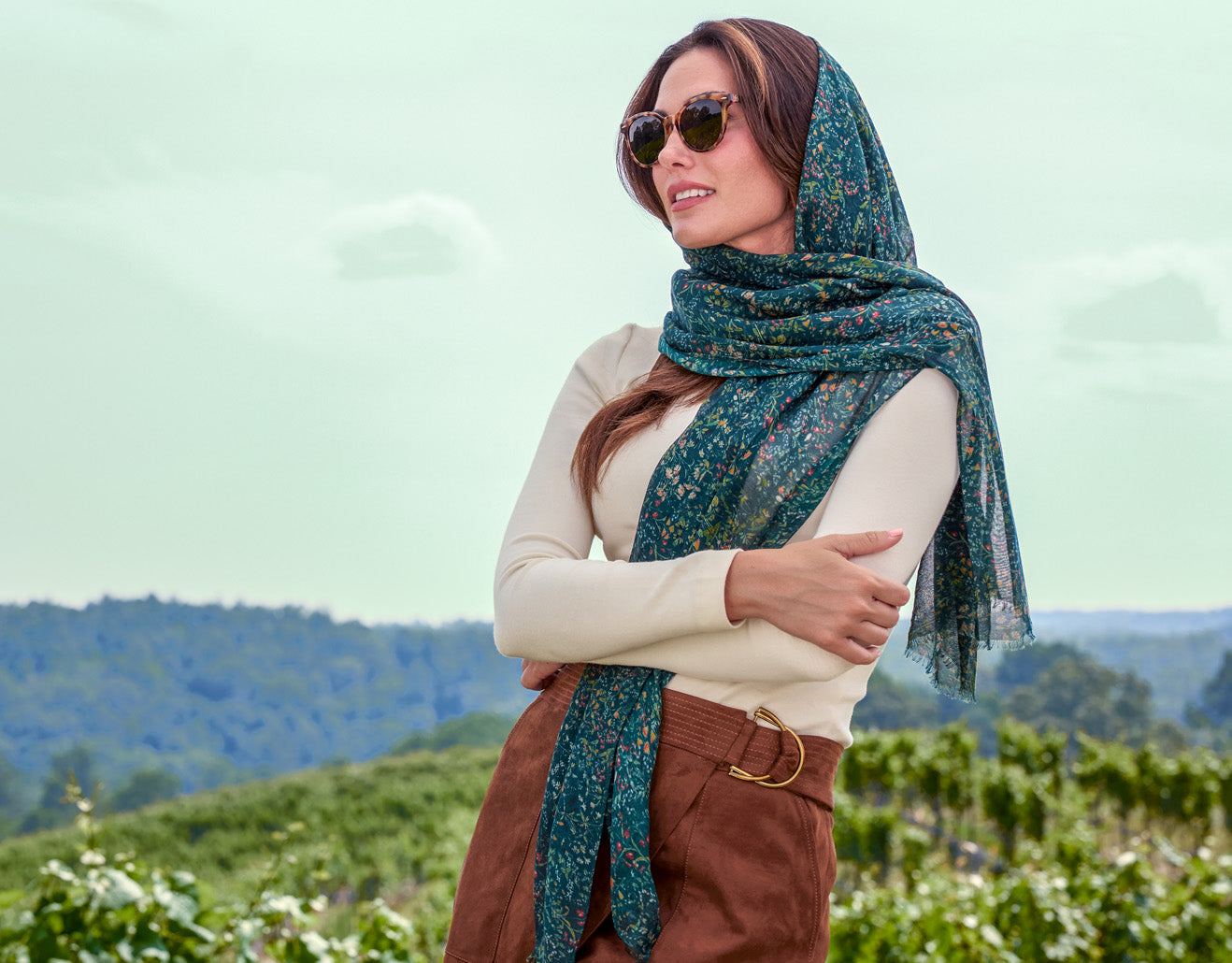 Model wearing floral scarf by Patricia Nash, elegant accessory styled in lifestyle setting