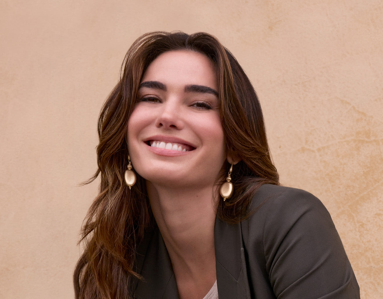 Model wearing Patricia Nash earrings, vintage-inspired jewelry featured in elegant lifestyle setting