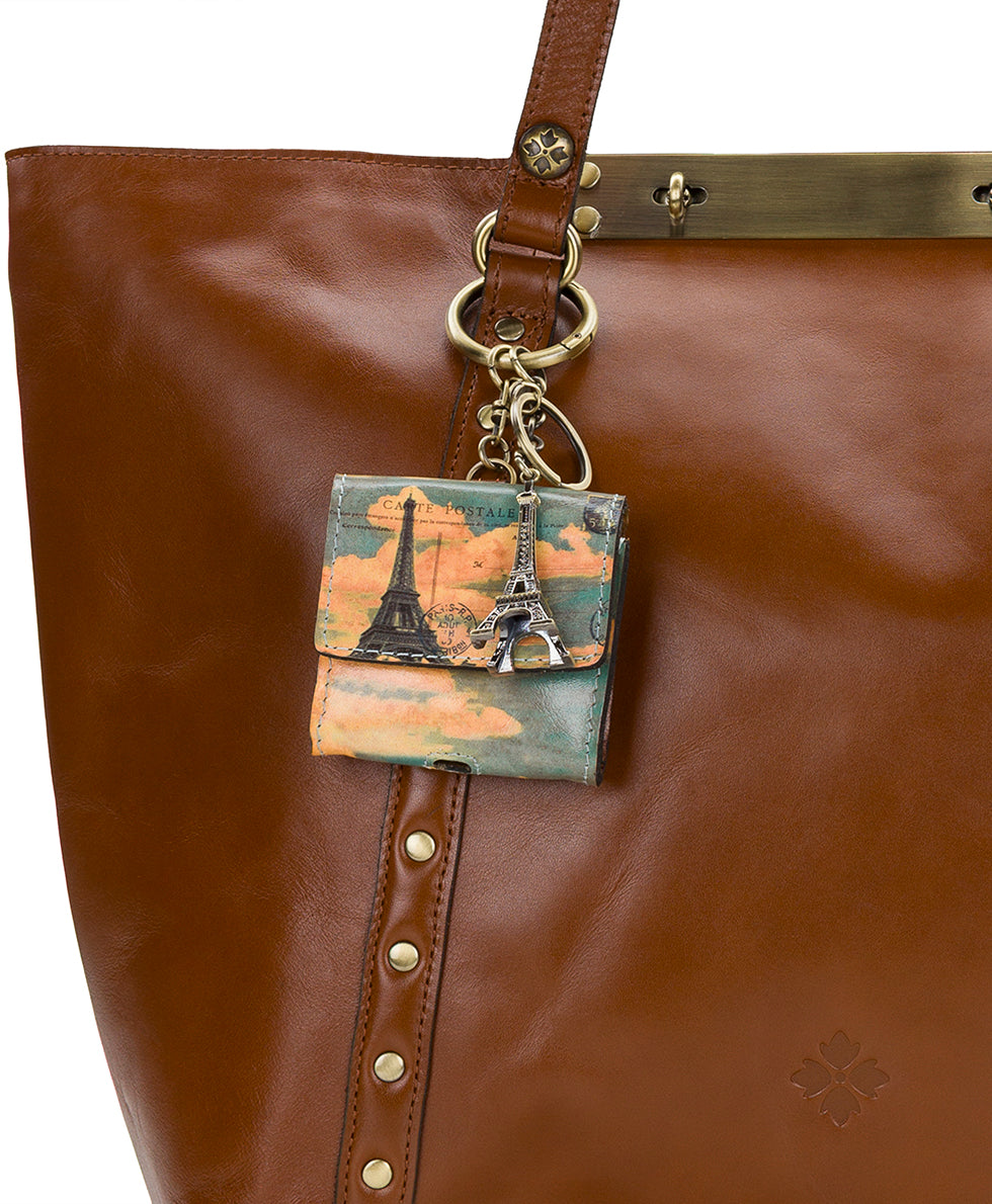 Female - Livigno Air Pod Case with Eiffel Tower Charm - Paris Postcard - paris postcard - by Patricia Nash - View 4 of 4