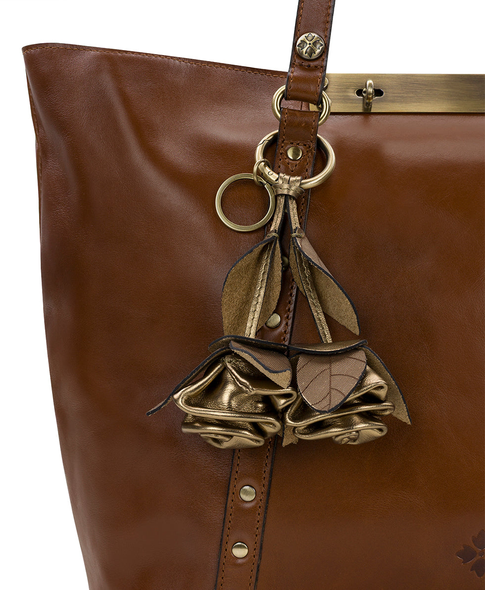 Female - Laced Rose Bag Charm - Laser Lace Burnished - antique gold - by Patricia Nash - View 2 of 3