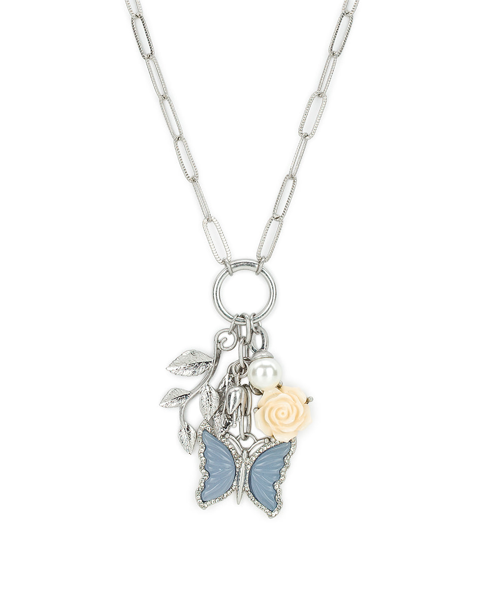 Female - Long Multi Charm Necklace - Blue Butterfly - worn rhodium - by Patricia Nash - View 1 of 3