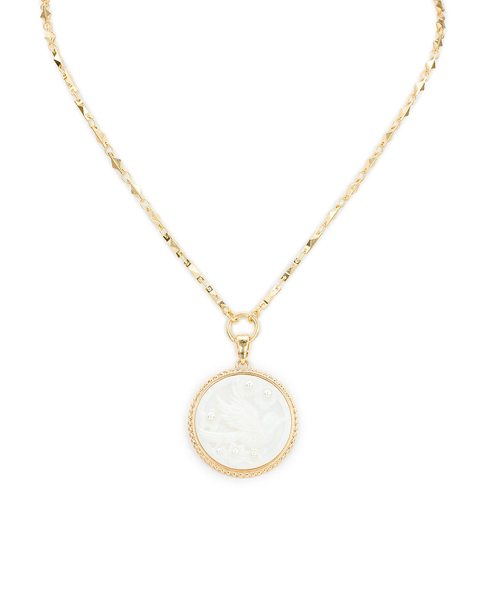 Female - Carved Bird Pendant - Mother of Pearl Bird Collection - worn gold - by Patricia Nash - View 1 of 3