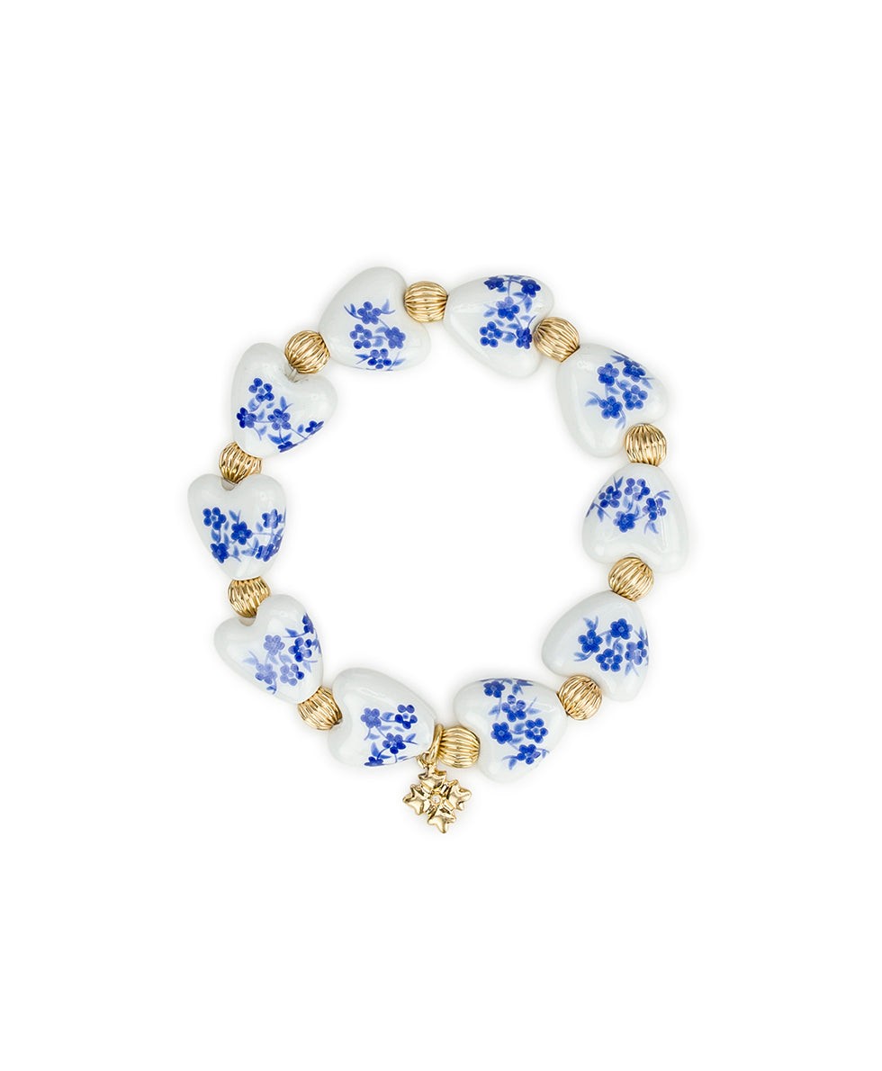 Female - Heart Stretch Bracelet - Blue Ceramic Collection - worn gold - by Patricia Nash - View 1 of 4