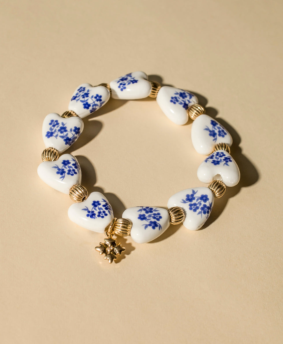 Female - Heart Stretch Bracelet - Blue Ceramic Collection - worn gold - by Patricia Nash - View 3 of 4